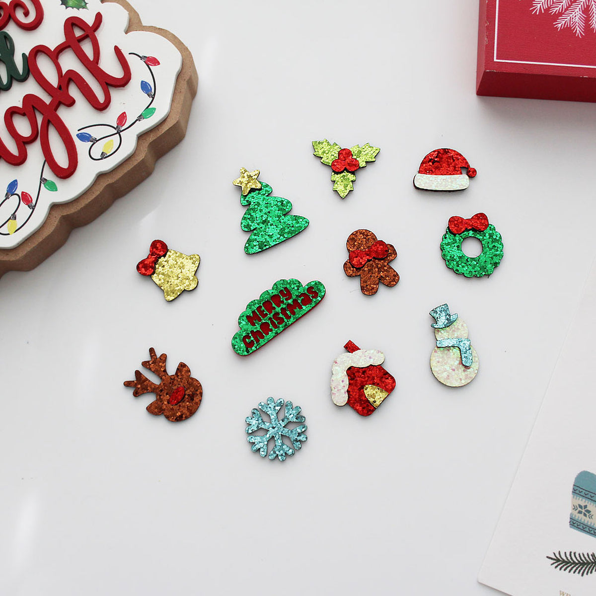 Sparkly holiday craft appliques flat lay with holiday decorations