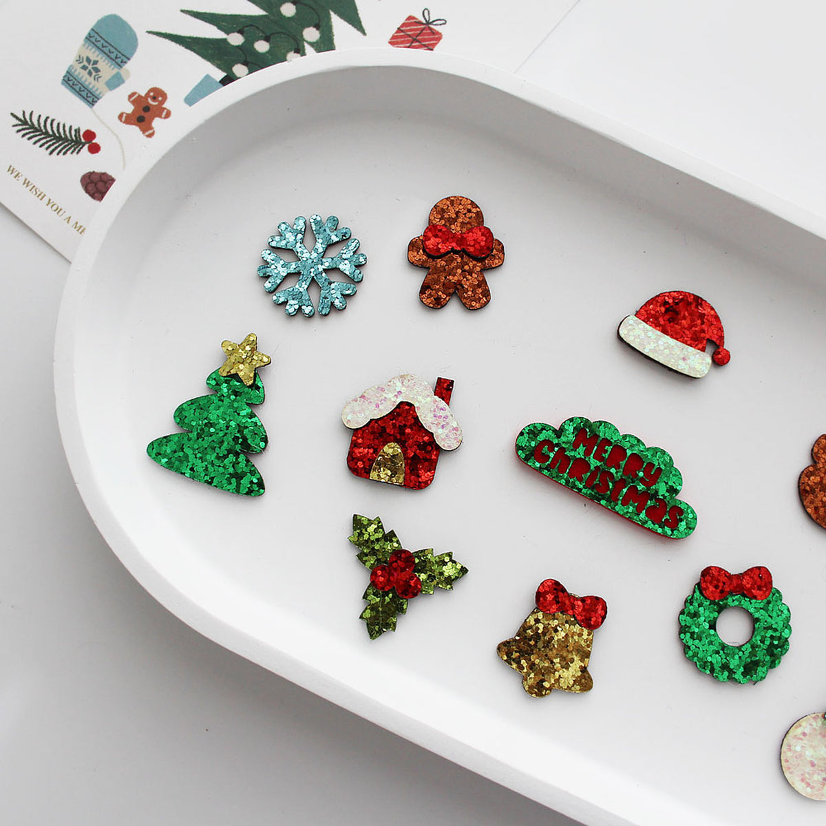 Close-up festive glitter craft appliques Christmas designs