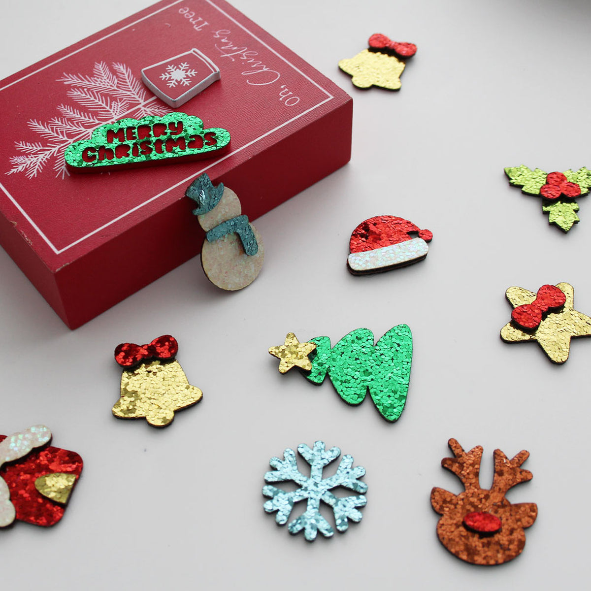 Christmas-themed glitter appliques with red gift box
