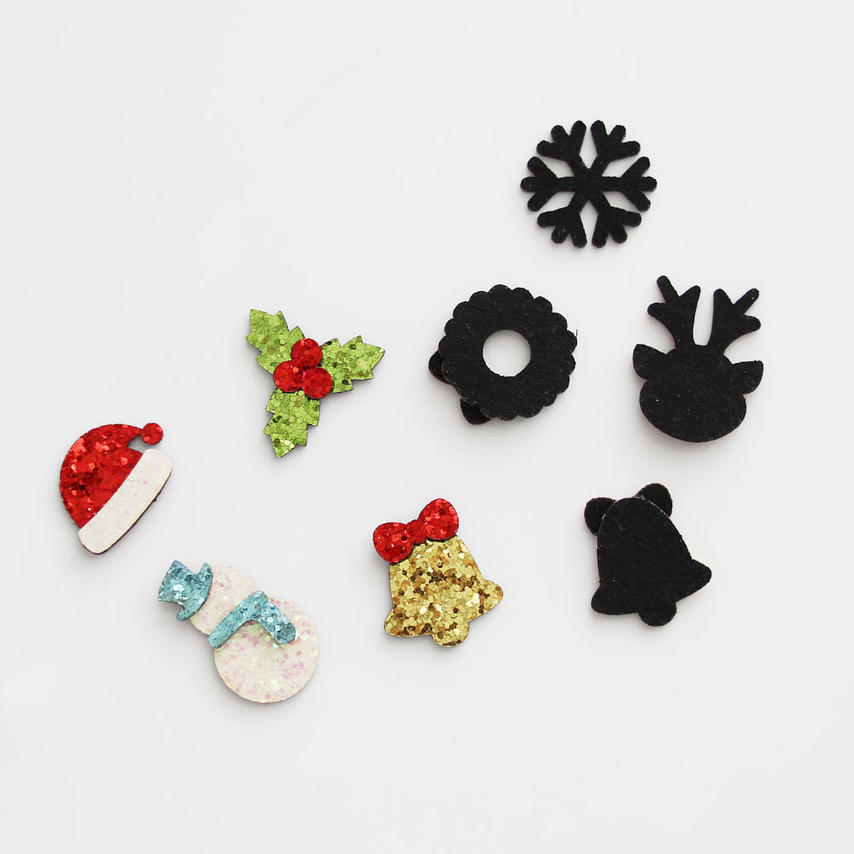Reverse side of Christmas glitter appliques with black backing